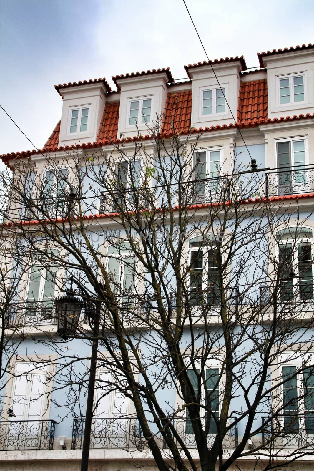 Narrow and colorful streets, majestic facades, windows and balconies of Lisbon, Portugal