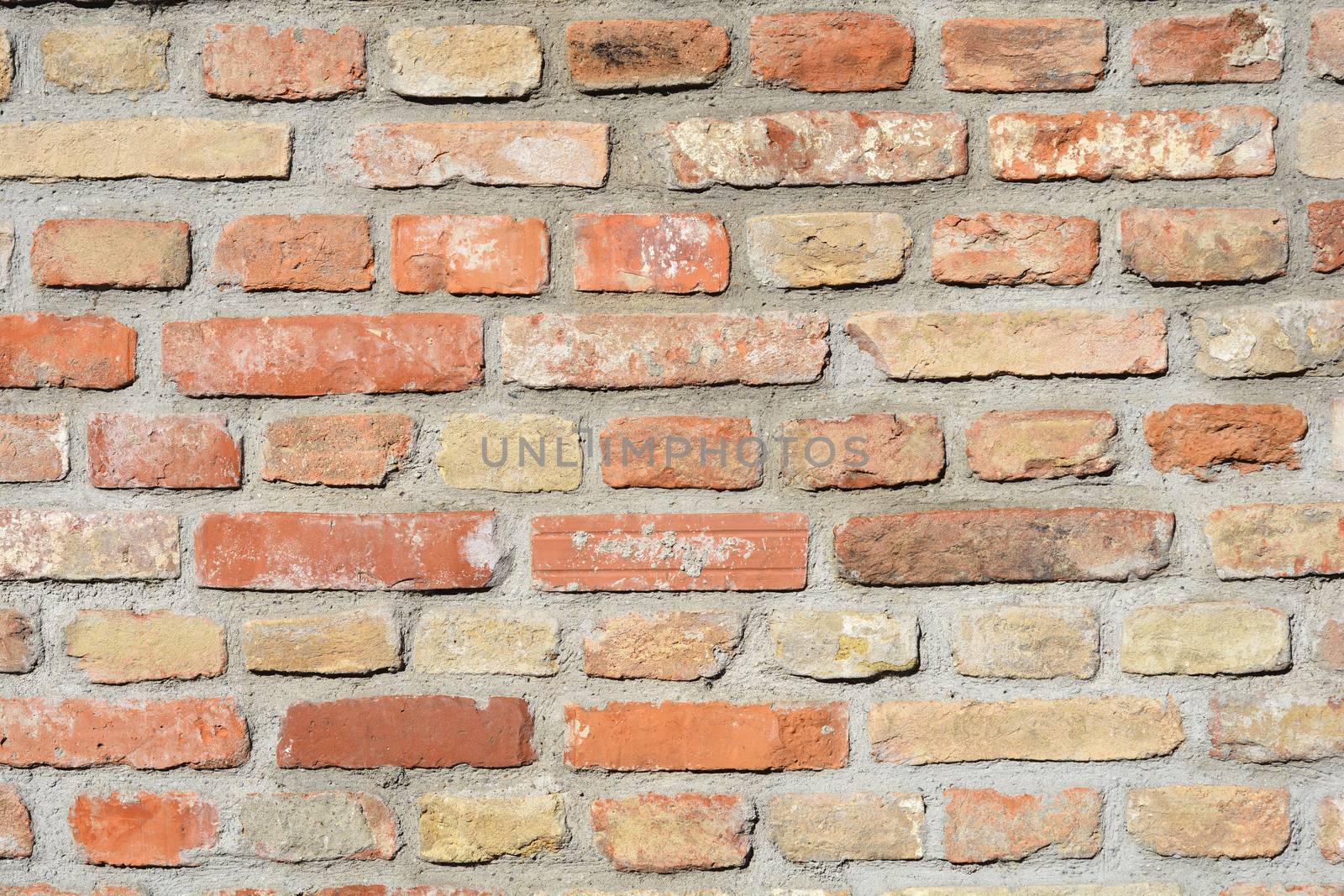 Detail of an old orange brick wall