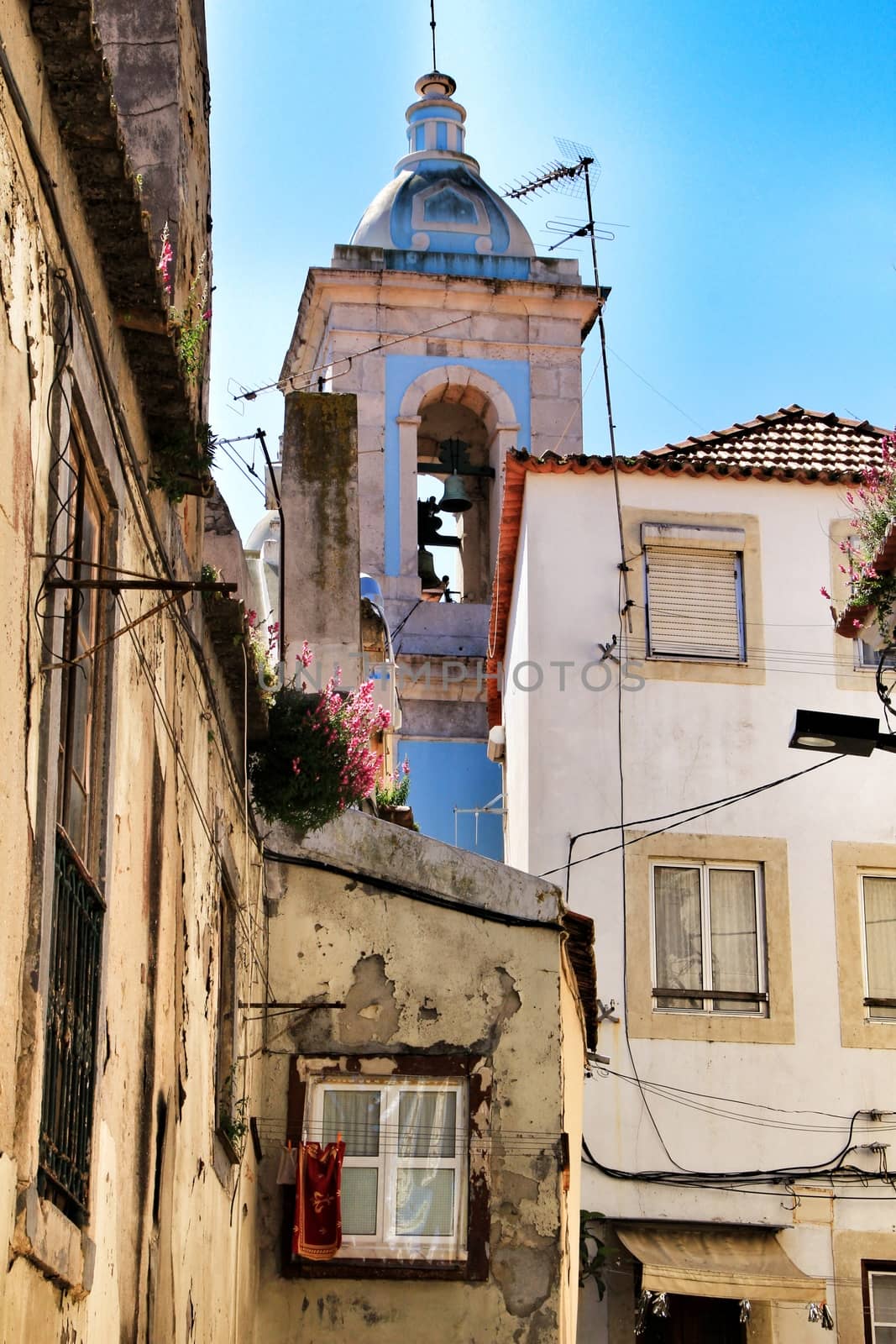 Old colorful houses and streets of Lisbon, Portugal in Spring. Majestic facades and old street lights.