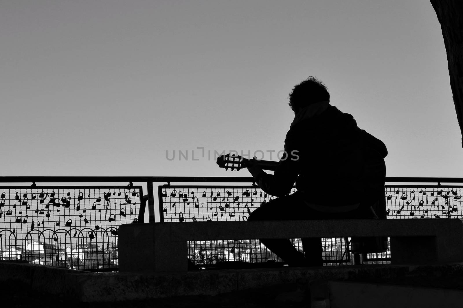 Musician playing fado music on a viewpoint in Lisbon in the morning in a sunny day of Spring