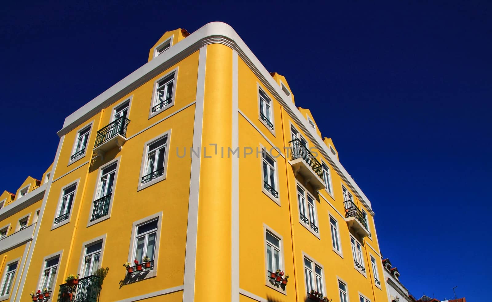 Old colorful houses and streets of Lisbon, Portugal in Spring. Majestic facades and old street lights.