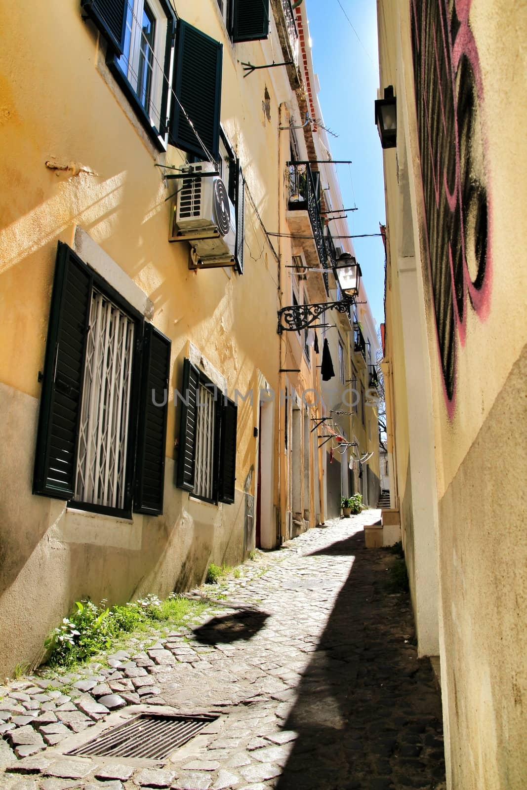 Old colorful houses and narrow streets of Lisbon, Portugal in Spring.