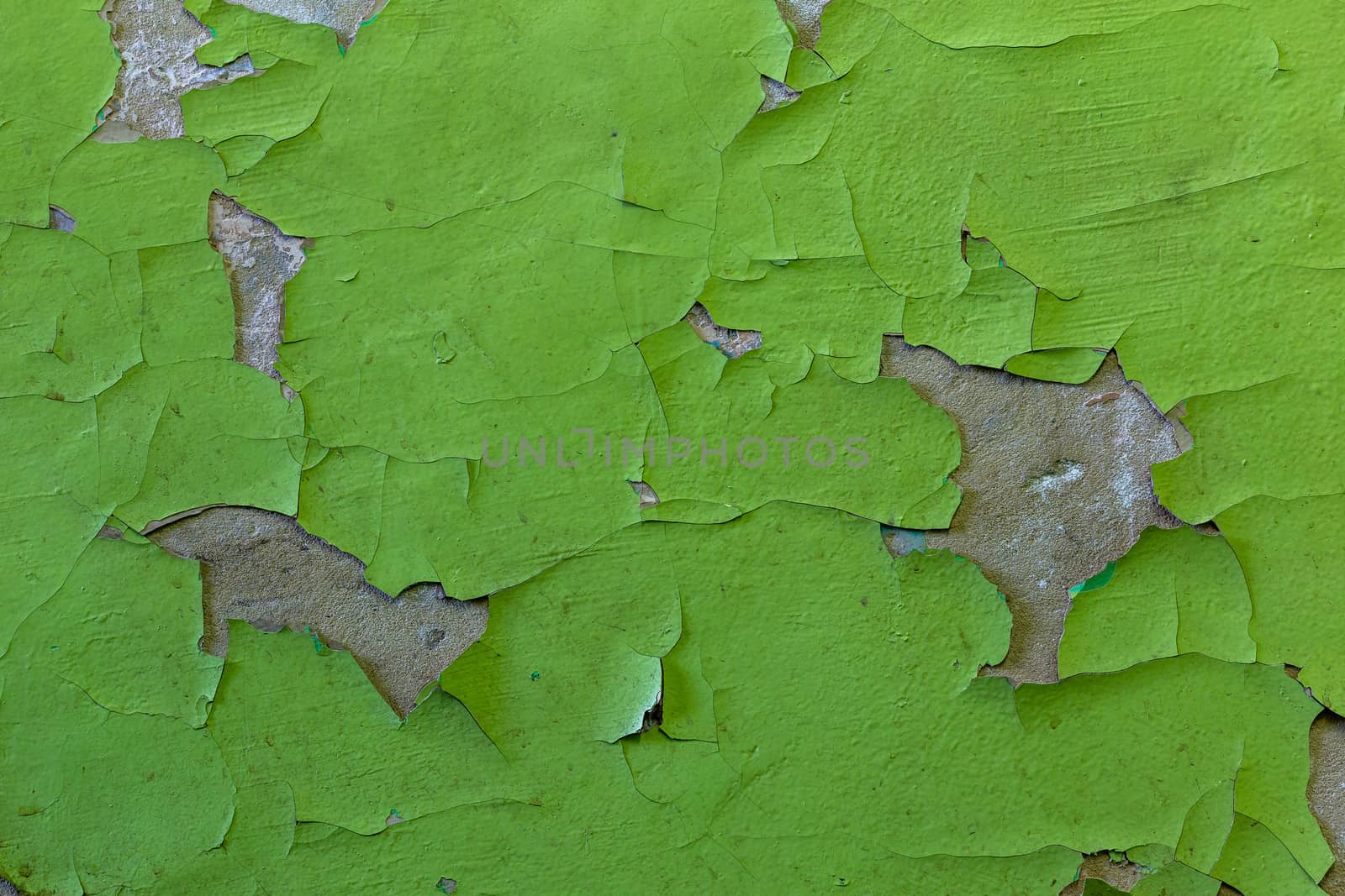 green peeling paint close-up background and texture.