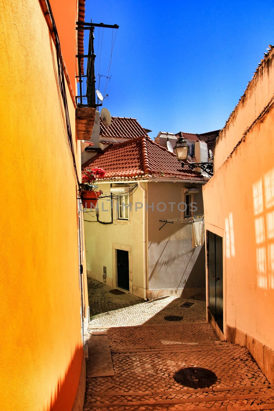 Narrow and colorful streets, majestic facades, windows and balconies of Lisbon, Portugal