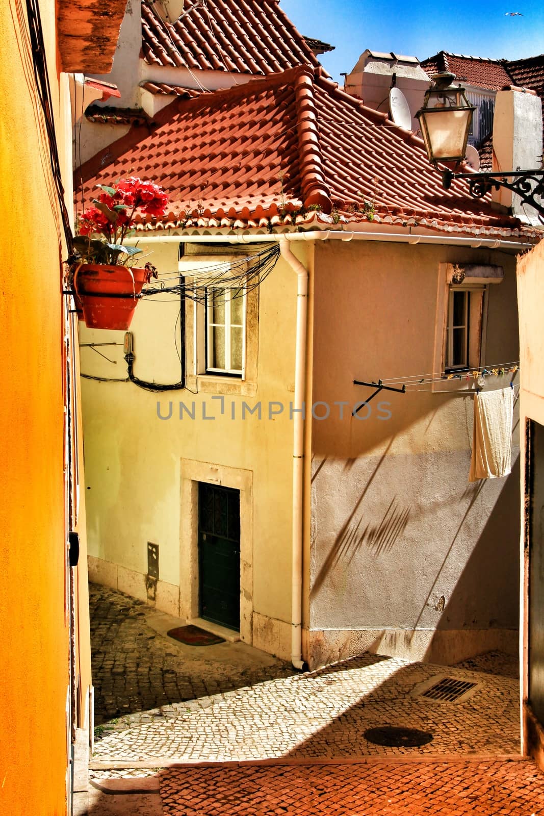 Narrow and colorful streets, majestic facades, windows and balconies of Lisbon, Portugal