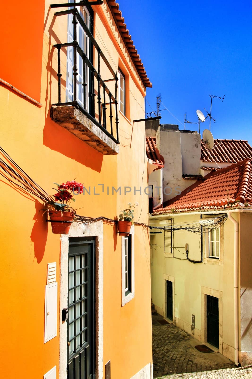 Narrow and colorful streets, majestic facades, windows and balconies of Lisbon, Portugal