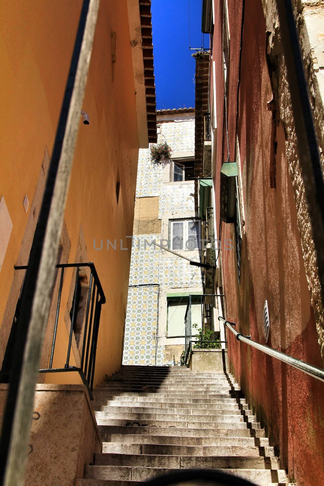Narrow and colorful streets, majestic facades, windows and balconies of Lisbon, Portugal