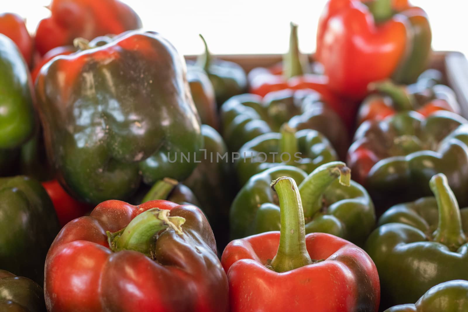 Close up of a Stack of Red and Green Bell Peppers . High quality photo