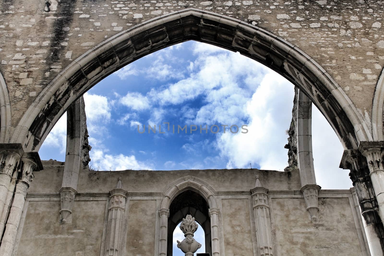Arcades, pillars and facade of Do Carmo convent in Lisbon, Portugal