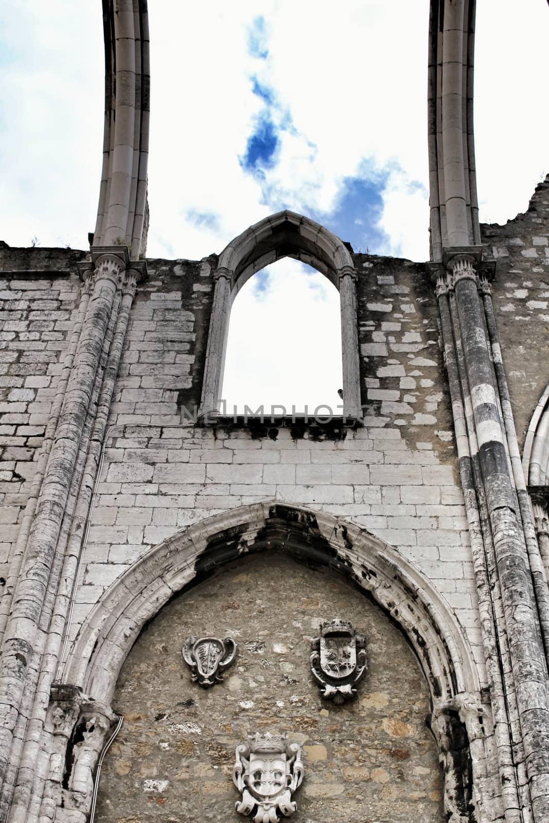 Arcades, pillars and facade of Do Carmo convent in Lisbon, Portugal