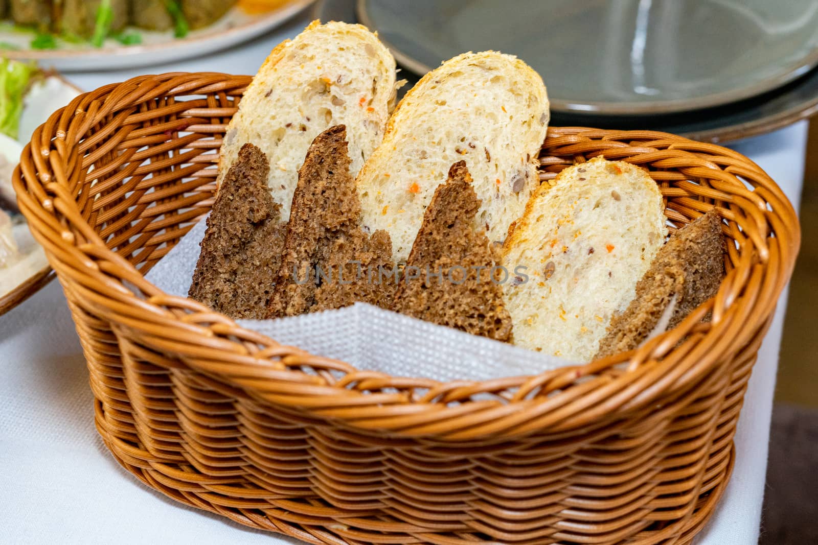 Black and white bread in a basket by Serhii_Voroshchuk