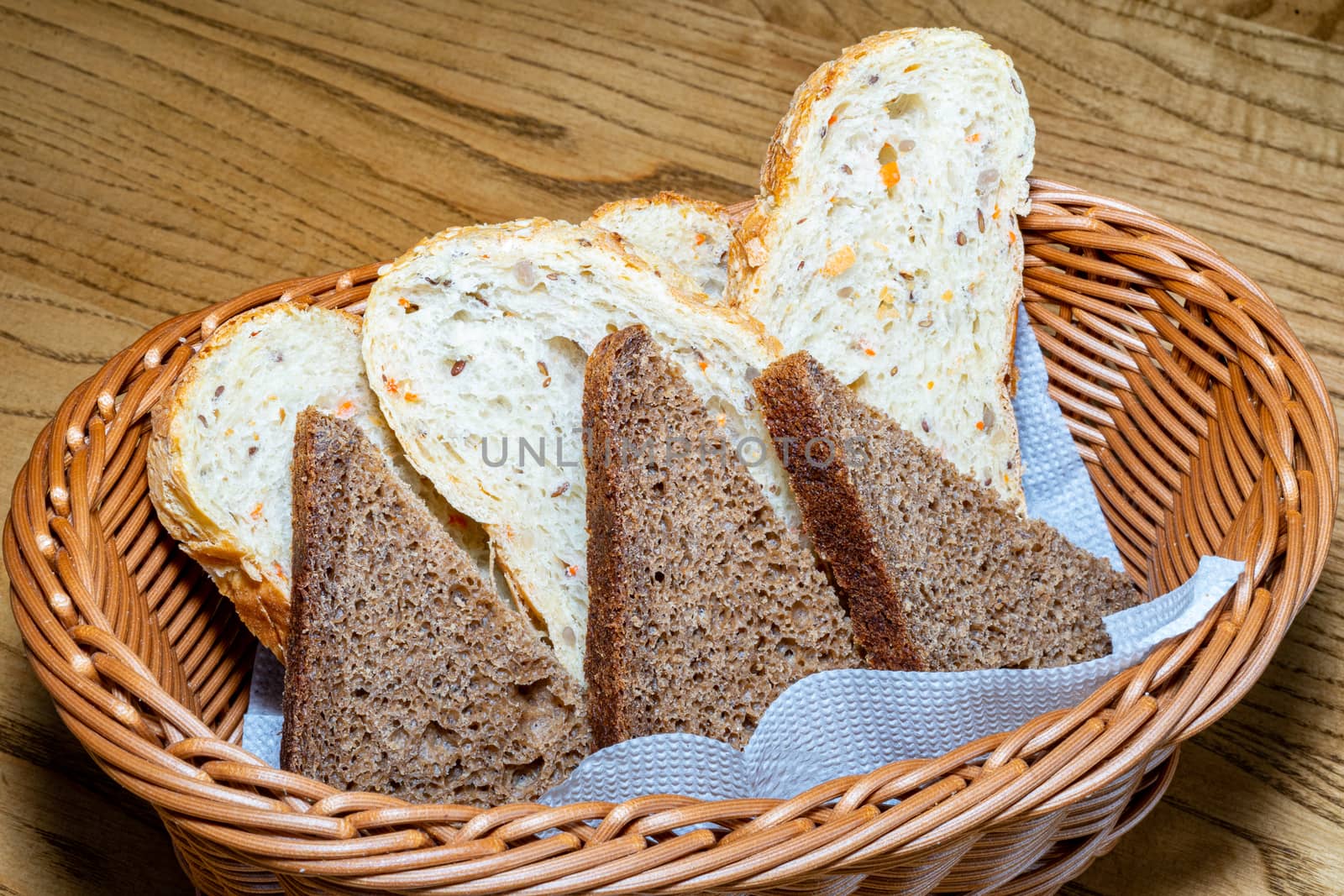 Black and white bread in a basket by Serhii_Voroshchuk