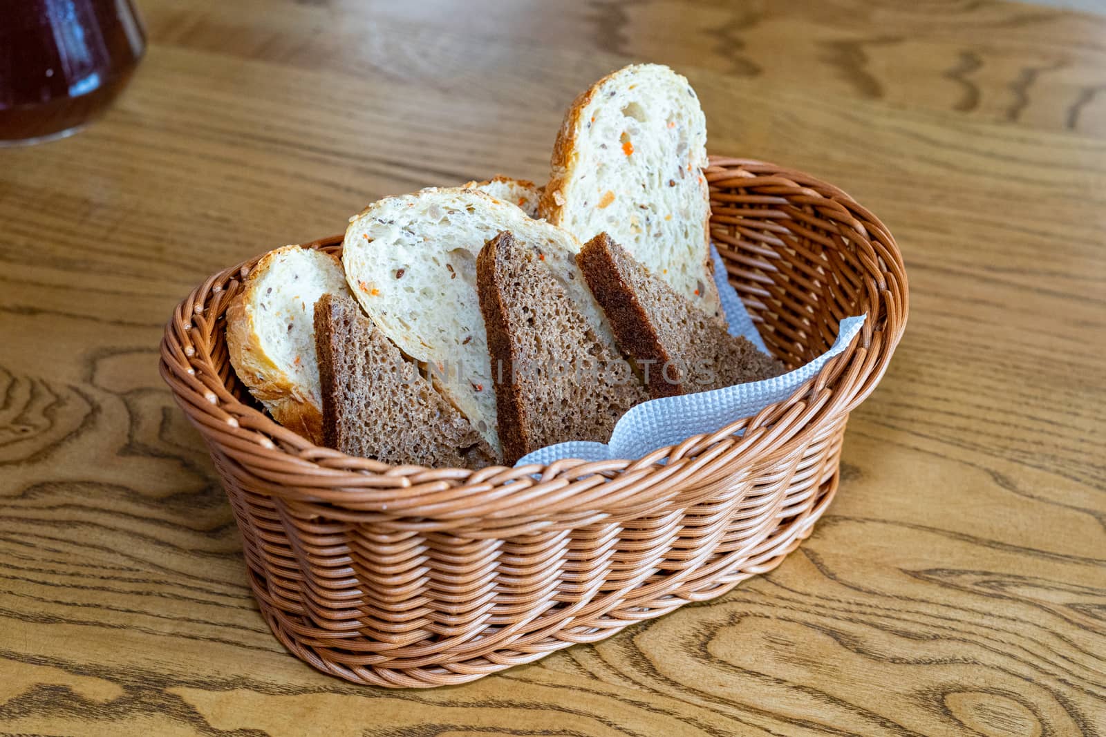Black and white bread in a basket. Sliced bread in a basket. Pieces of bread are ready to eat