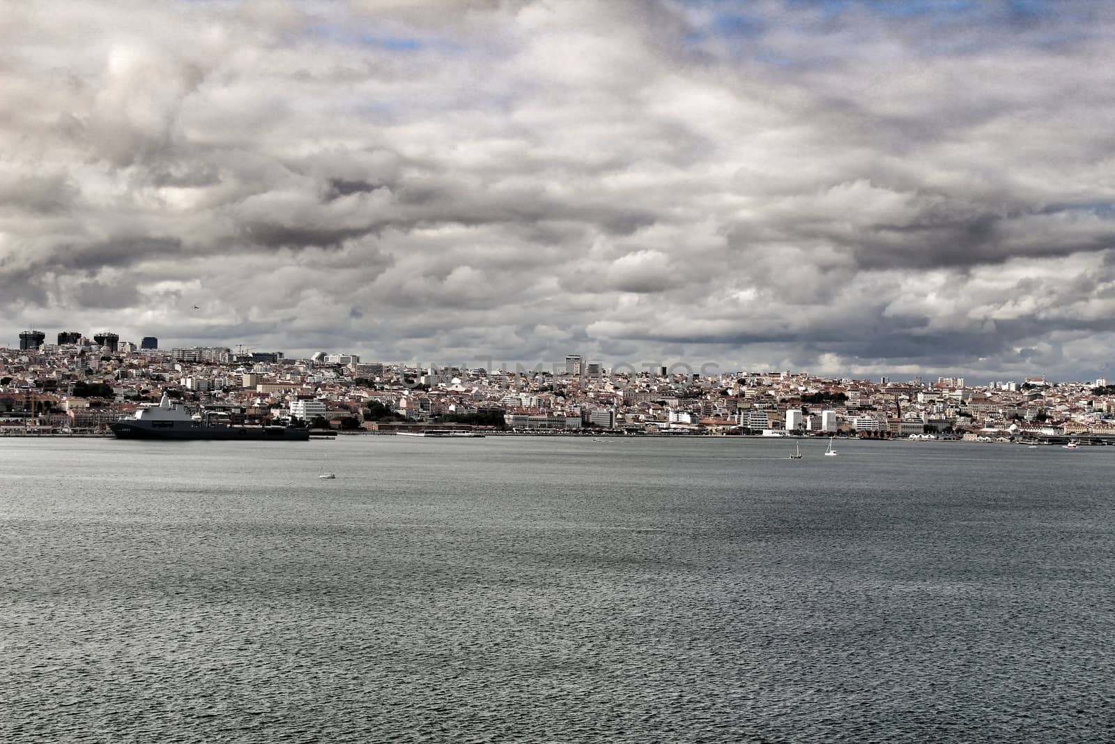 Panoramic of Lisbon city from Almada village in a cloudy day in Spring