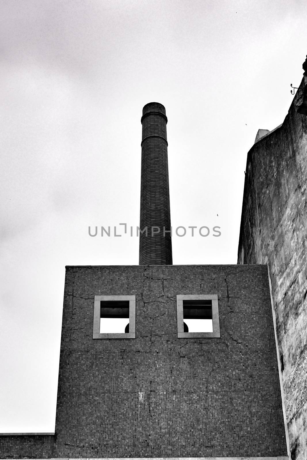 Old abandoned factory and smelting furnace in Lisbon. Monochrome photography.