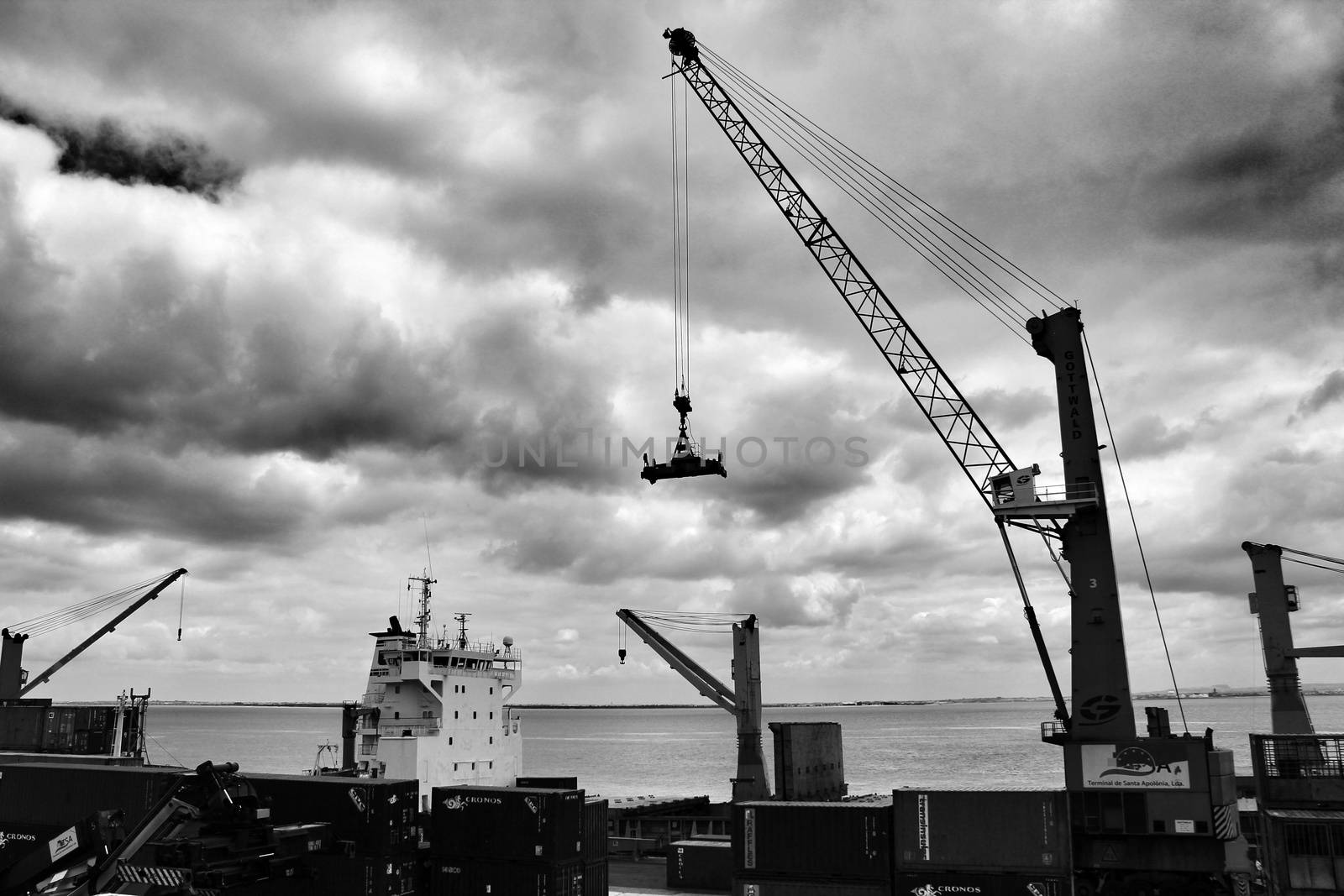 Lisbon, Portugal- June 3, 2018: Crane and containers on the dock in the port of Lisbon, Portugal