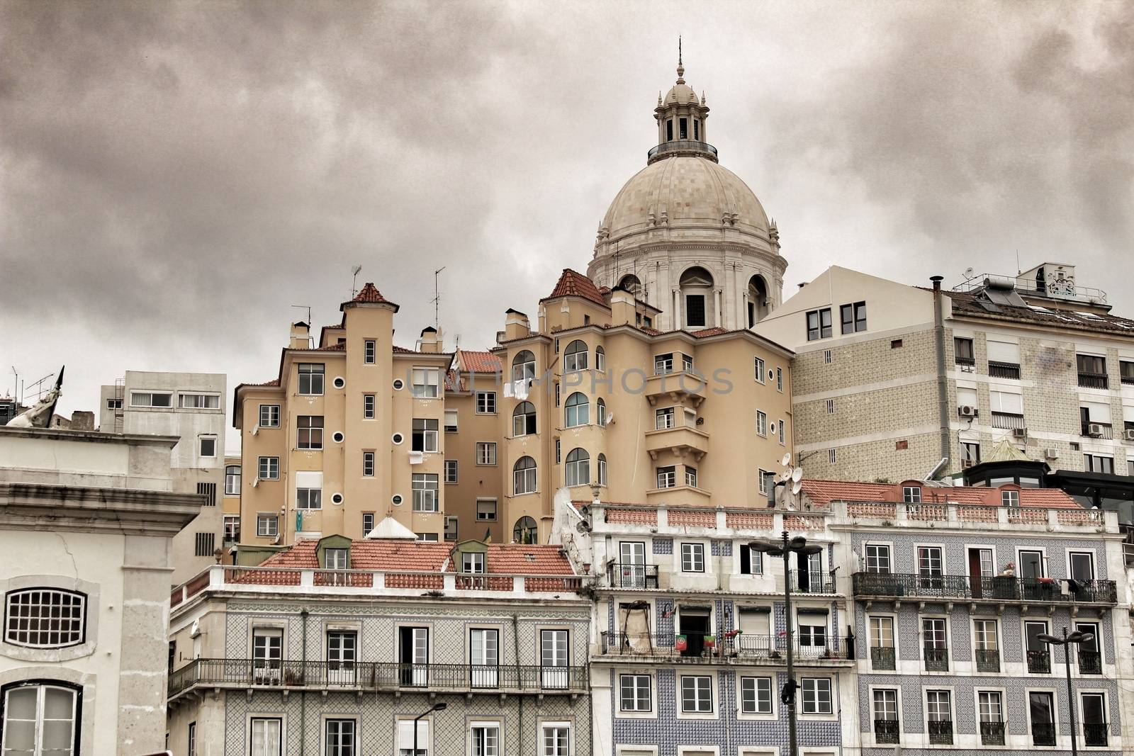 Majestic facades of Lisbon city and The National Pantheon in the background on a cloudy day of Spring