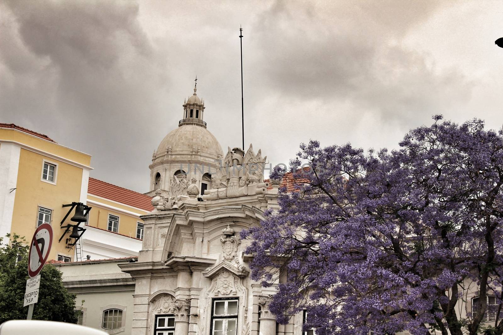 Majestic facades of Lisbon city and The National Pantheon in the background on a cloudy day of Spring