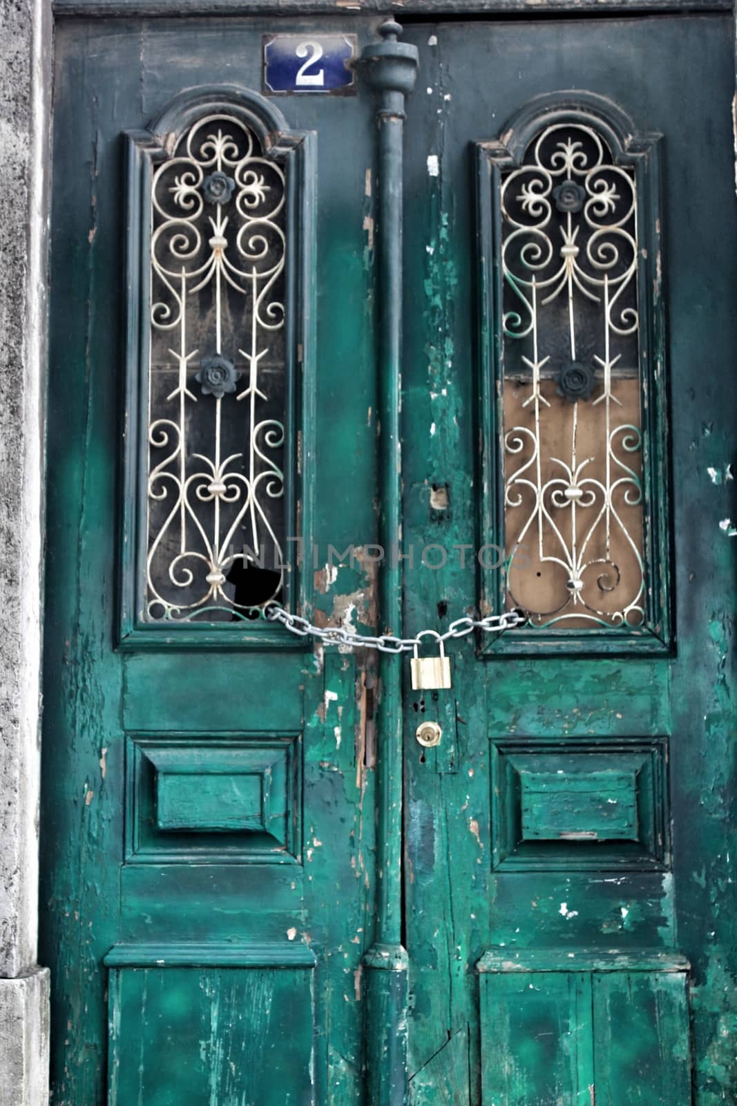 Old and colorful wooden door with iron details in Lisbon, Portugal