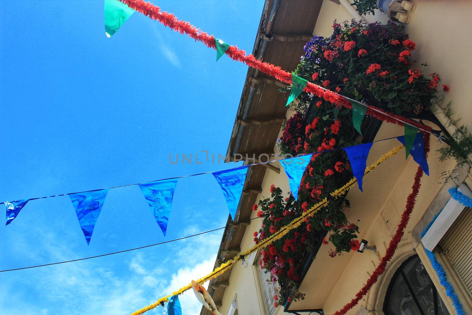 Streets adorned with garlands in Alfama, Lisbon by soniabonet