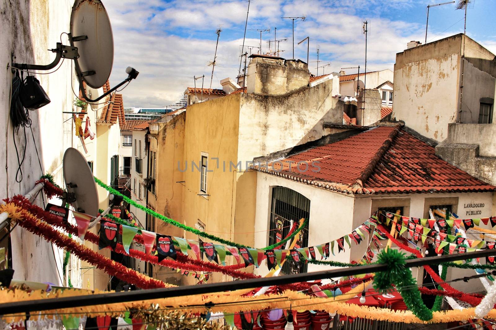 Streets adorned with garlands in Alfama, Lisbon by soniabonet