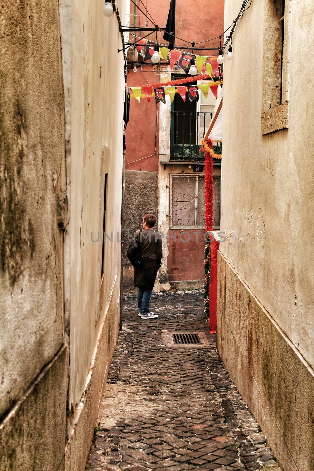 Streets adorned with garlands in Alfama, Lisbon by soniabonet