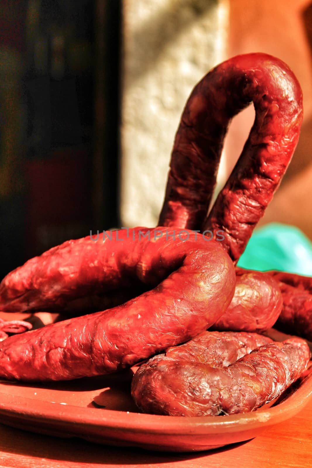 Spicy pork sausage for sale at a market stall by soniabonet