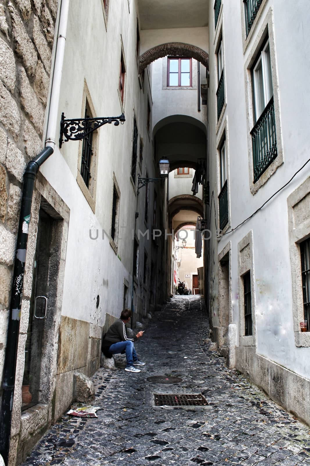 Lisbon, Portugal- June 4, 2018:Old colorful houses and streets of Lisbon, Portugal in Spring. Majestic facades and old street lights.