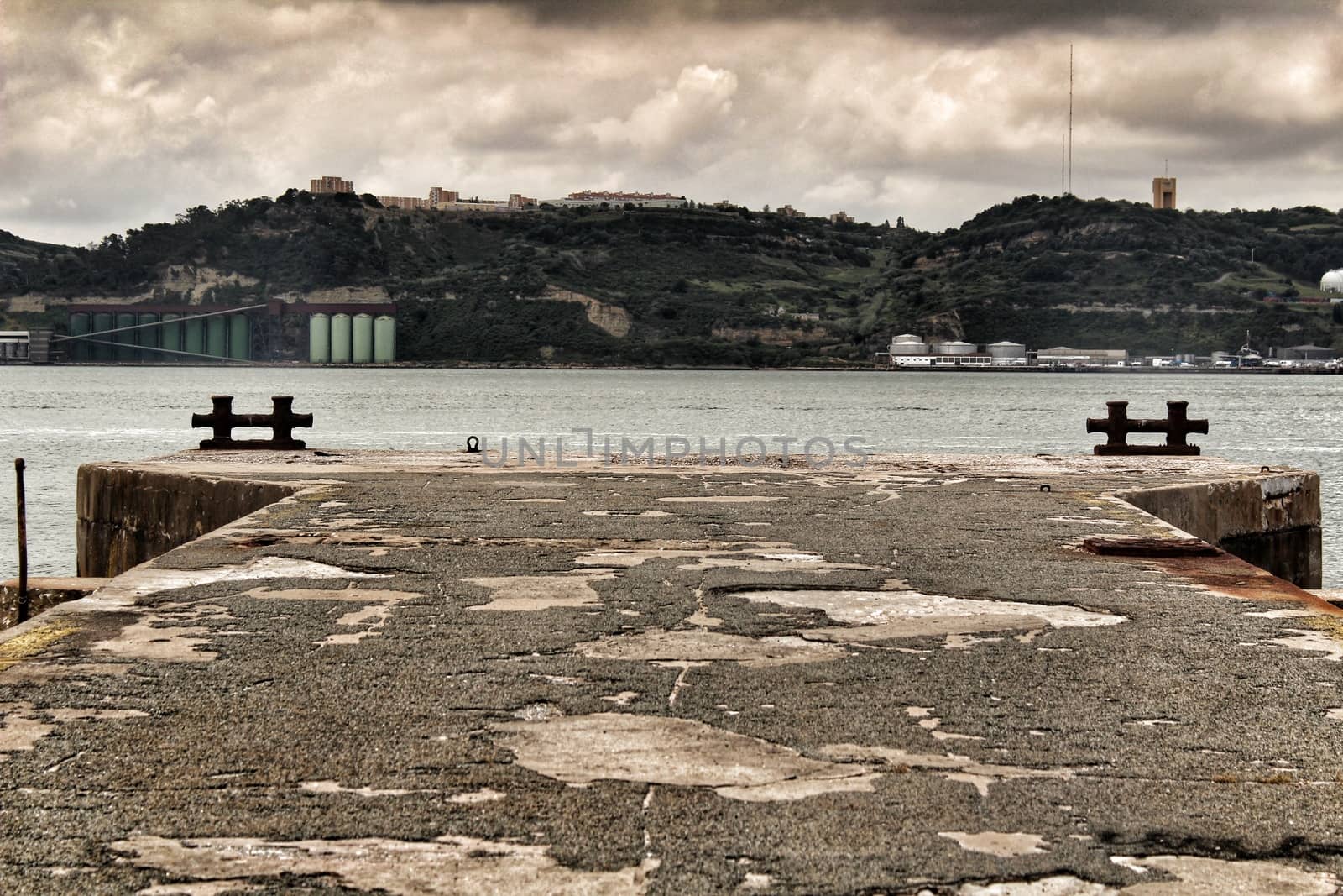 Dock on the shore of The Tagus River by soniabonet
