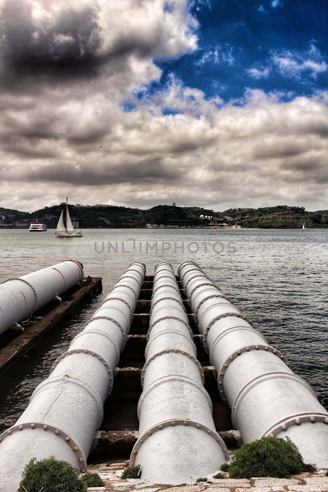 Drain pipes on the banks of The Tagus River by soniabonet