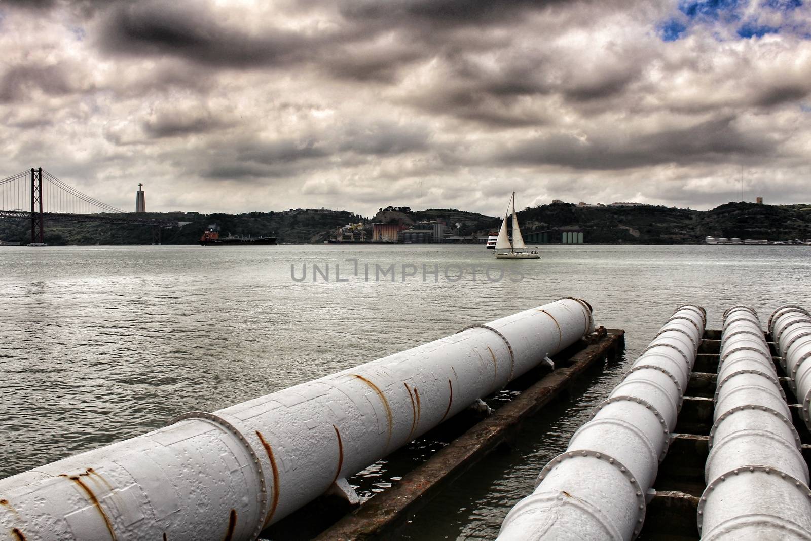Drain pipes on the banks of The Tagus River in Lisbon, Portugal