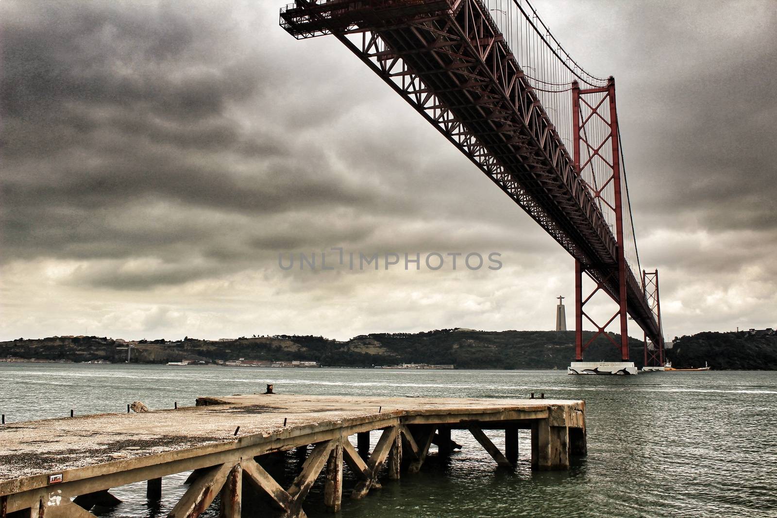 25th April Bridge in Lisbon on a cloudy day by soniabonet