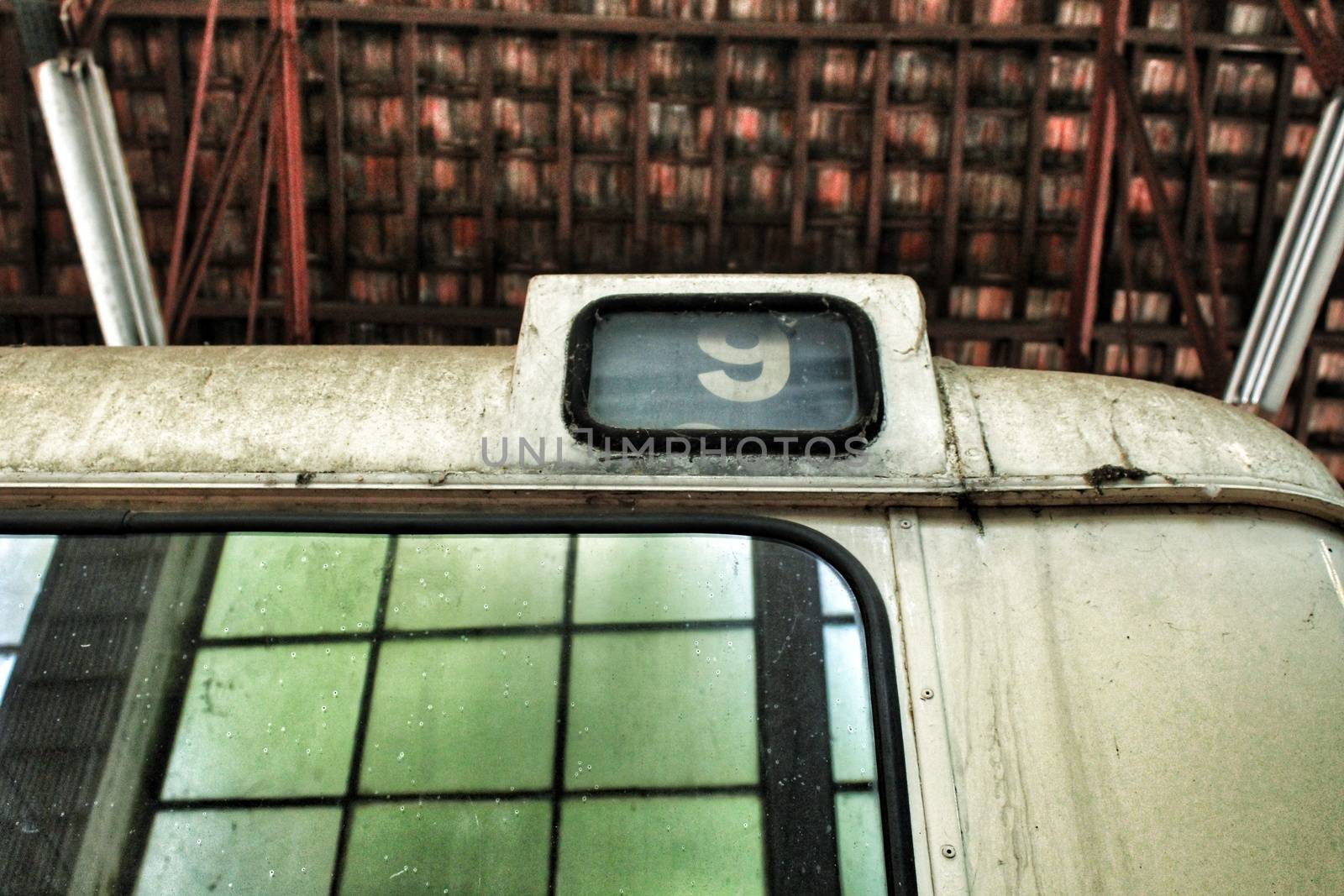 Texture and background of old school bus with number nine and tile background