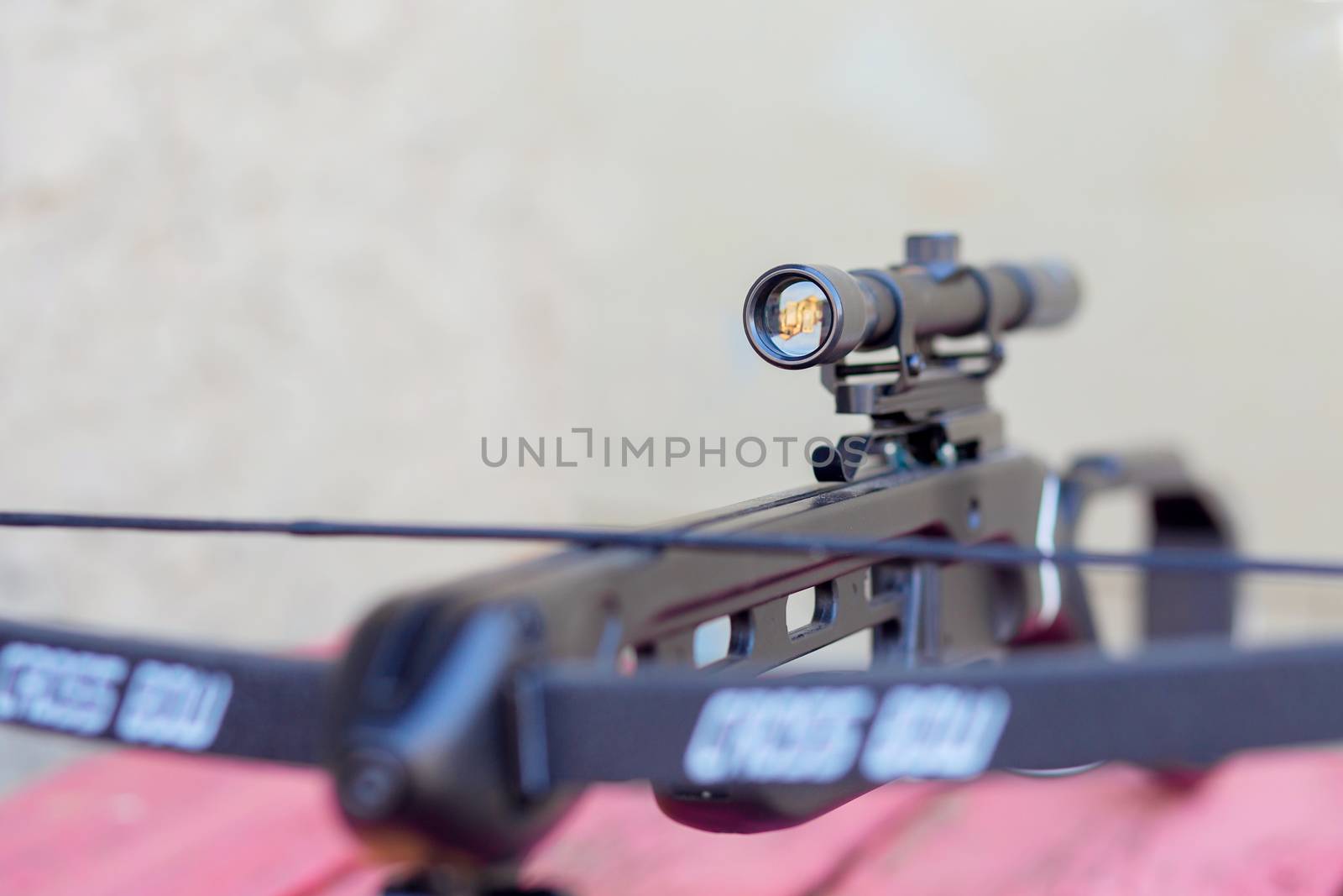 A close-up of the optical sight of a hunting crossbow. Details of the weapon.