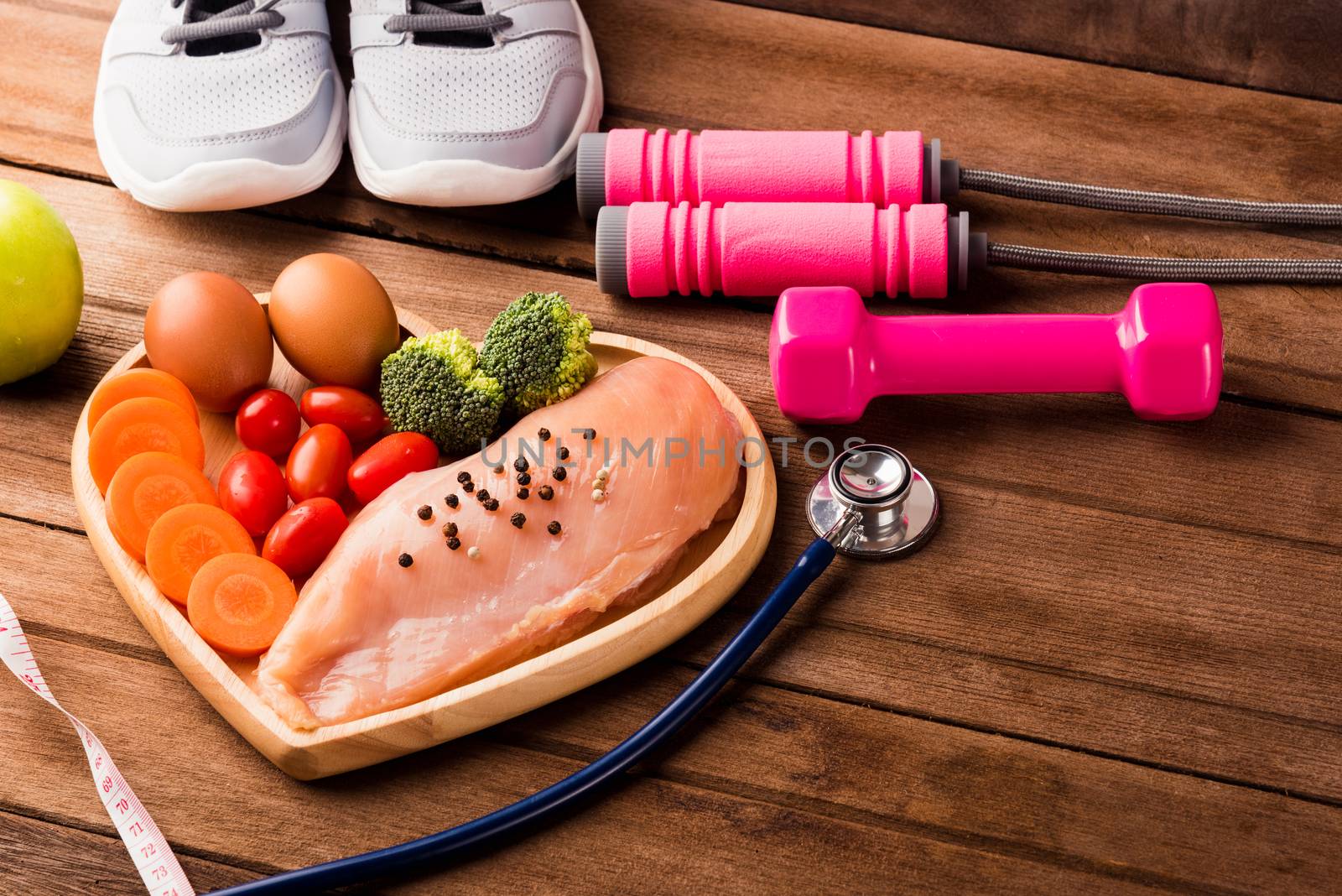 Raw chicken breasts fillets in heart plate wood and sport or ath by Sorapop
