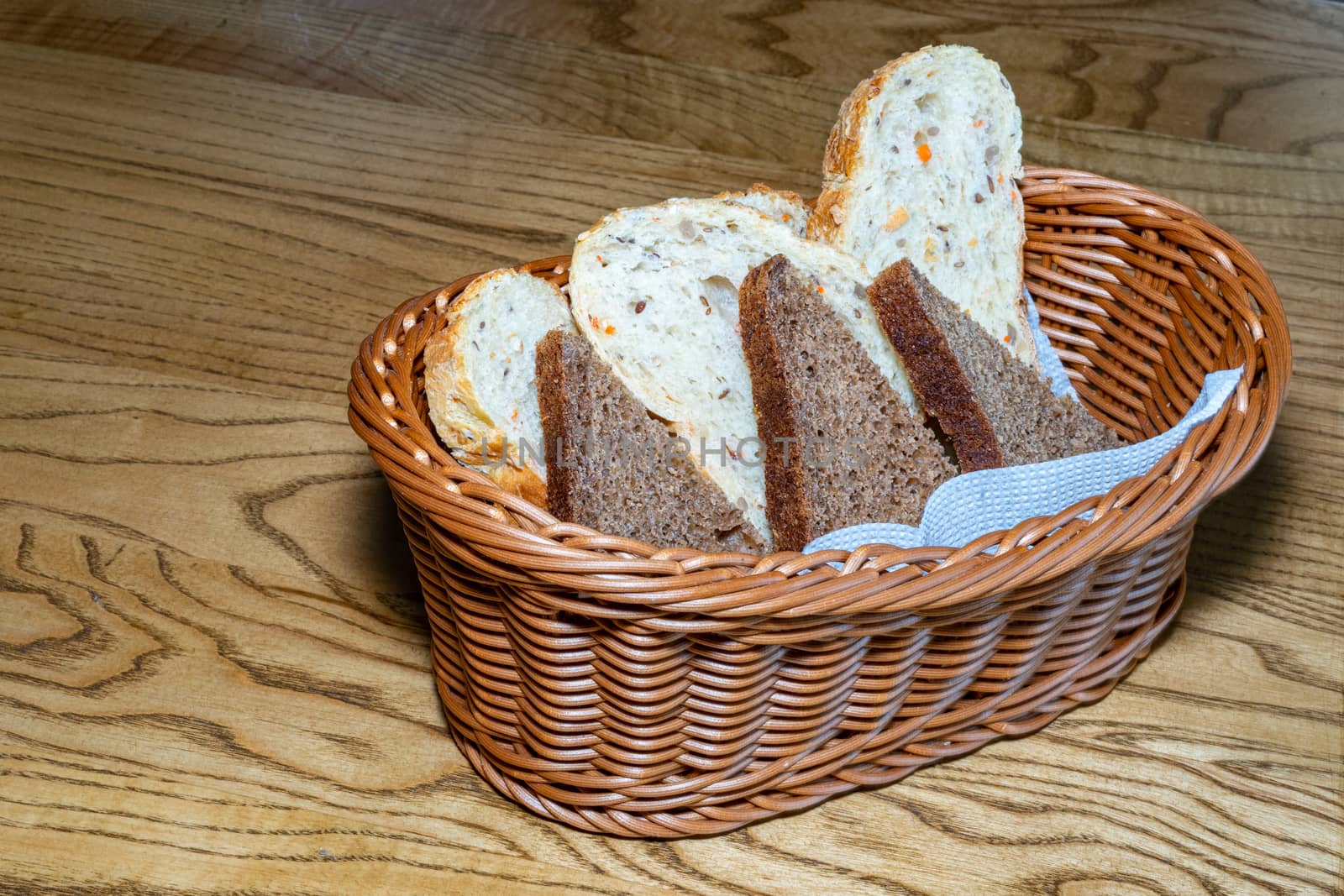 Black and white bread in a basket by Serhii_Voroshchuk