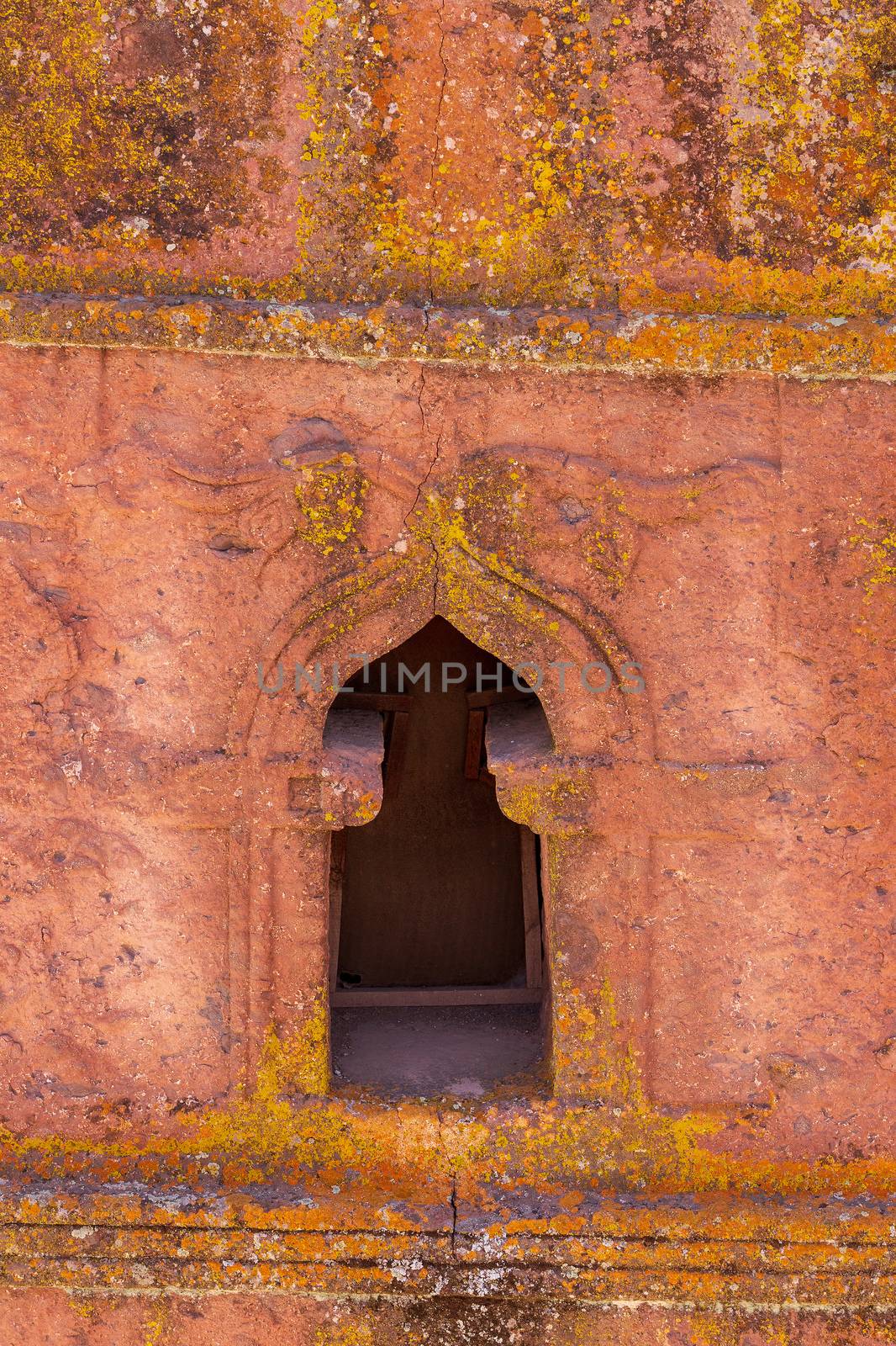 detail of carved window in Rock-hewn Church of Saint George in the shape of a cross, Bete Giyorgis, monolithic church in Lalibela, UNESCO World Heritage Site Rock-Hewn Churches. The Church was carved downwards from one monolitic stone