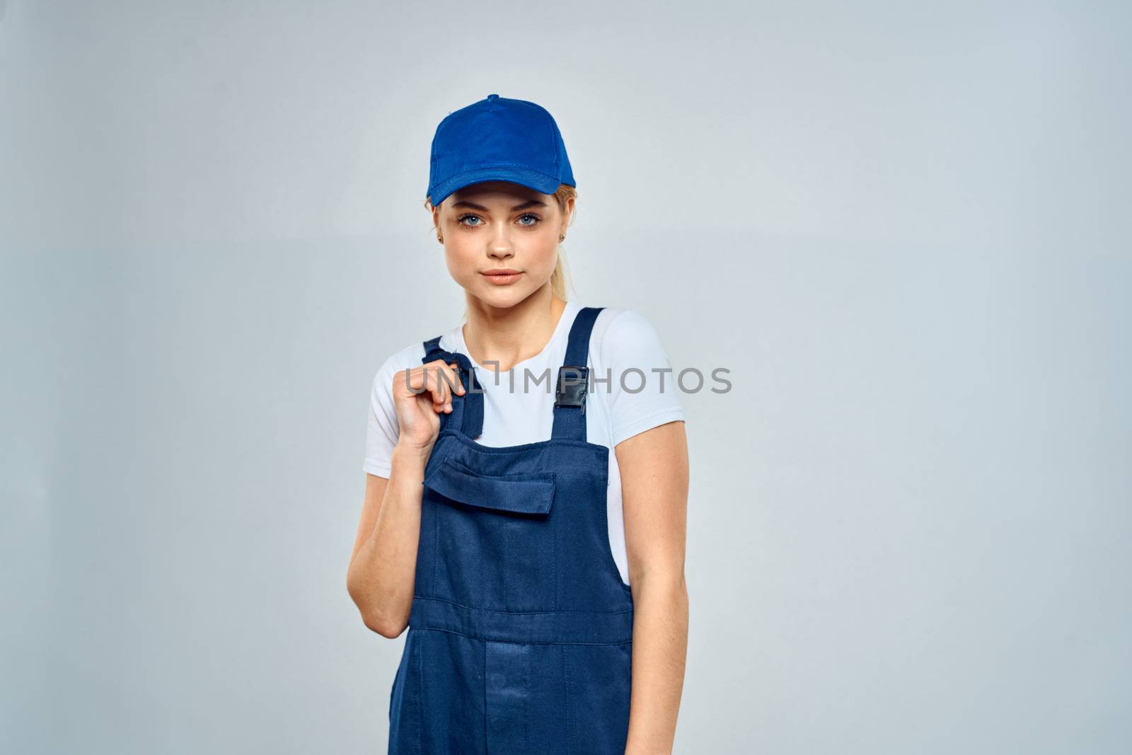 Woman in working uniform blue cap service lifestyle service. High quality photo