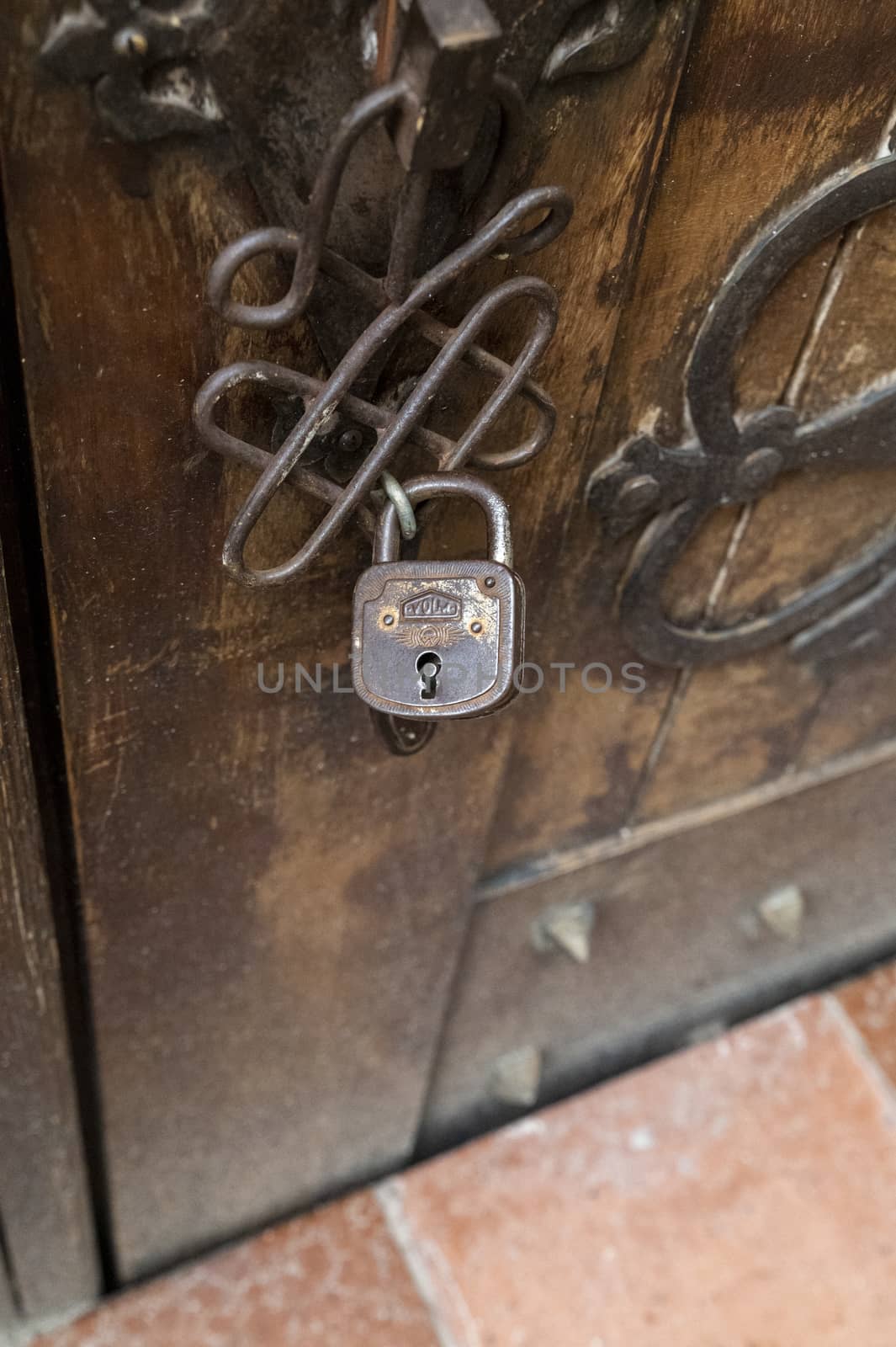 terni,italy october 16 2020:vintage padlock on an ancient door of a country