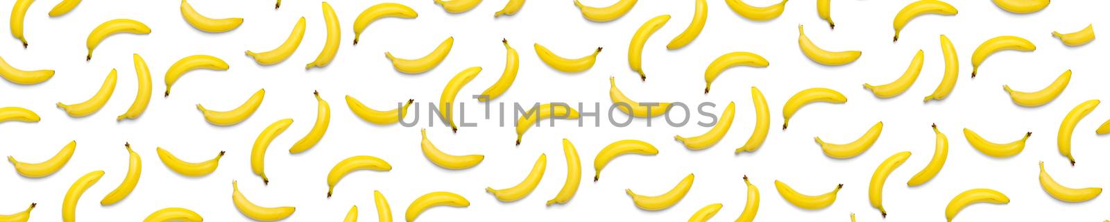 Bananas creative background. pop art bananas background. Tropical abstract background with banana. Colorful fruit yellow banana by PhotoTime