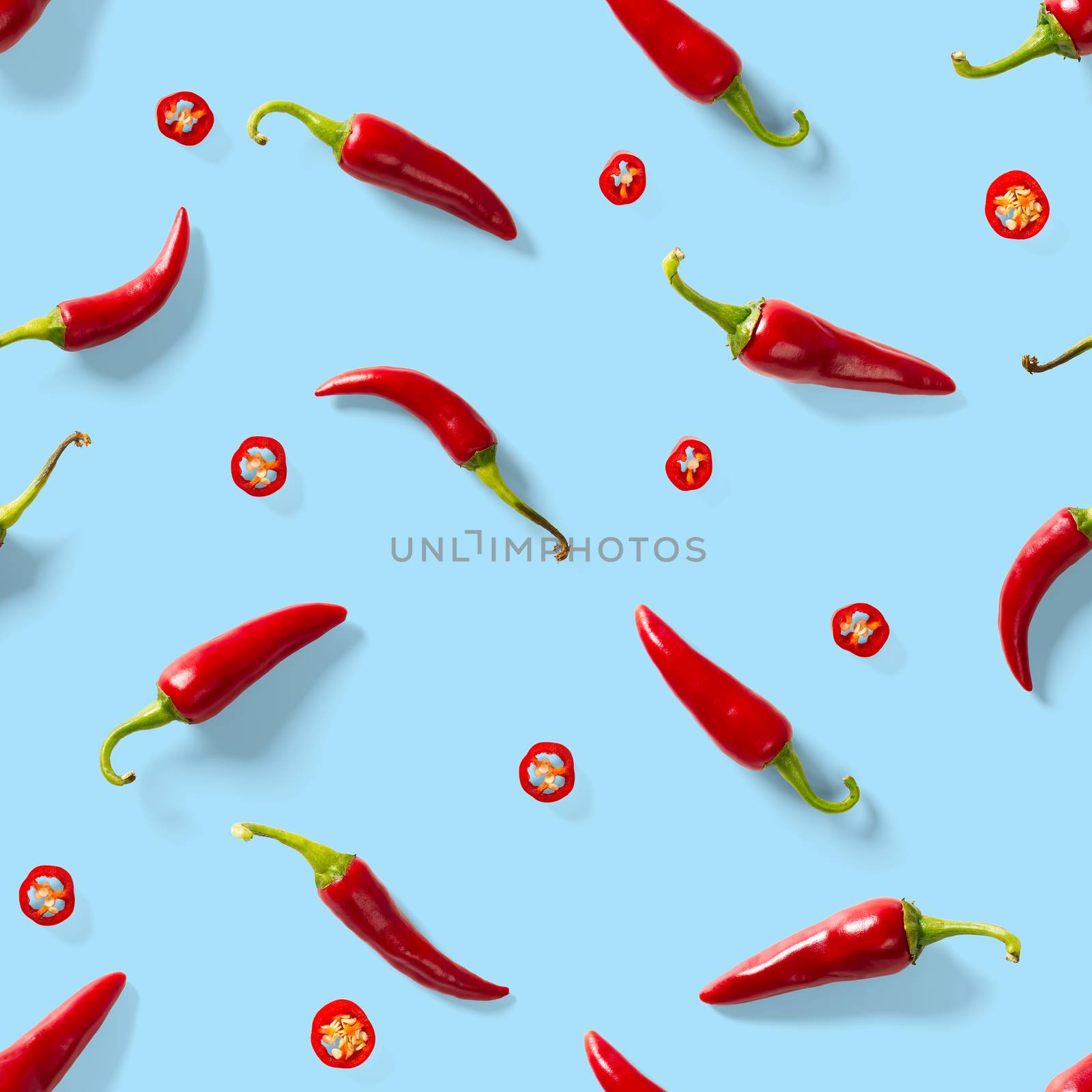 Red hot chilli seamless peppers pattern. Seamless pattern made of red chili or chilli on blue background. Minimal food pattern. Food background.