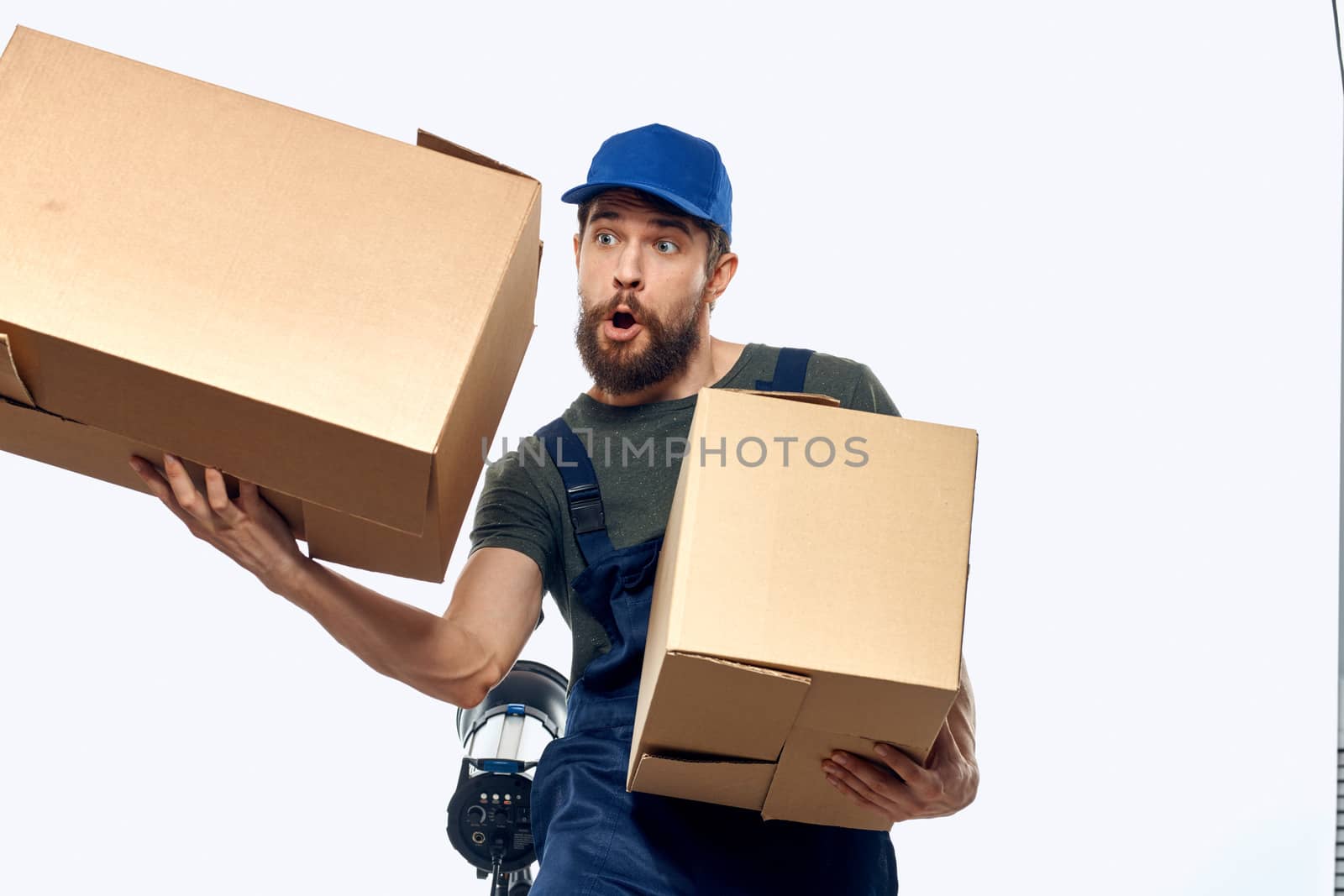 Working man with boxes in hands delivery service work lifestyle. High quality photo