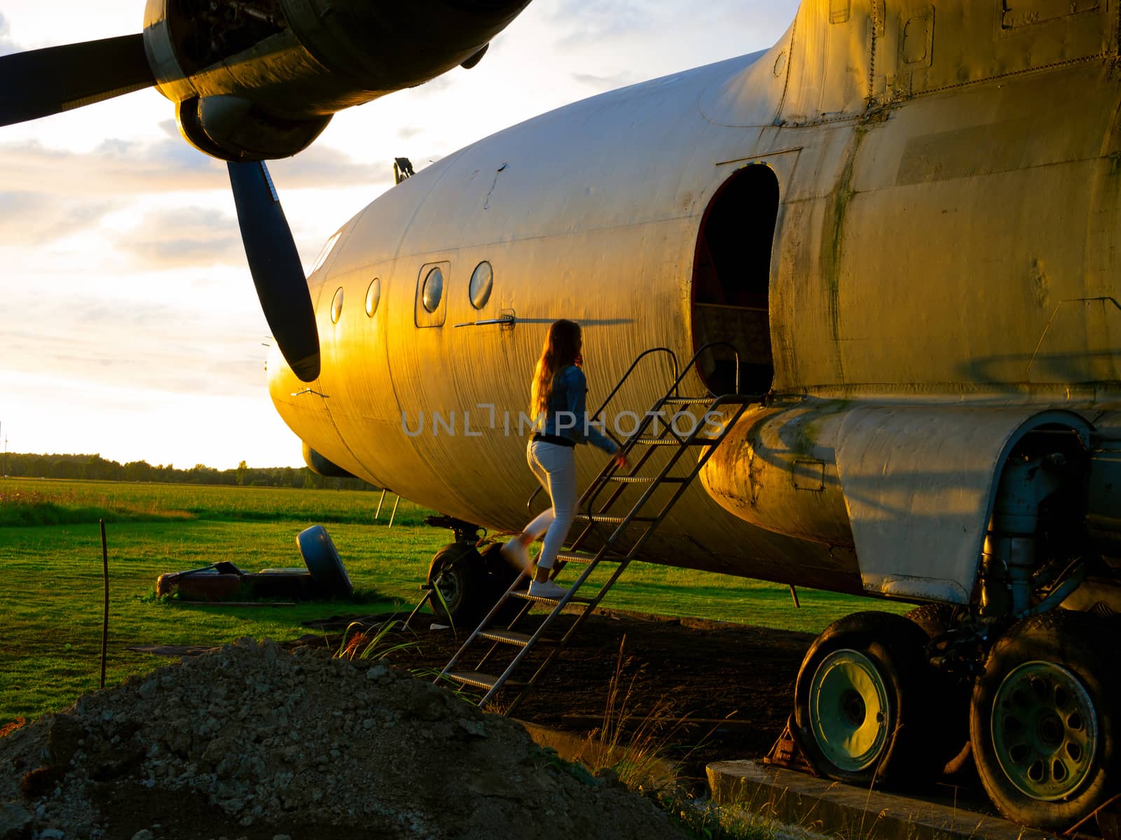 old Soviet military airplane, sunset time. Abandoned Historic Aircraft. Close up of propeller engine. Copy space