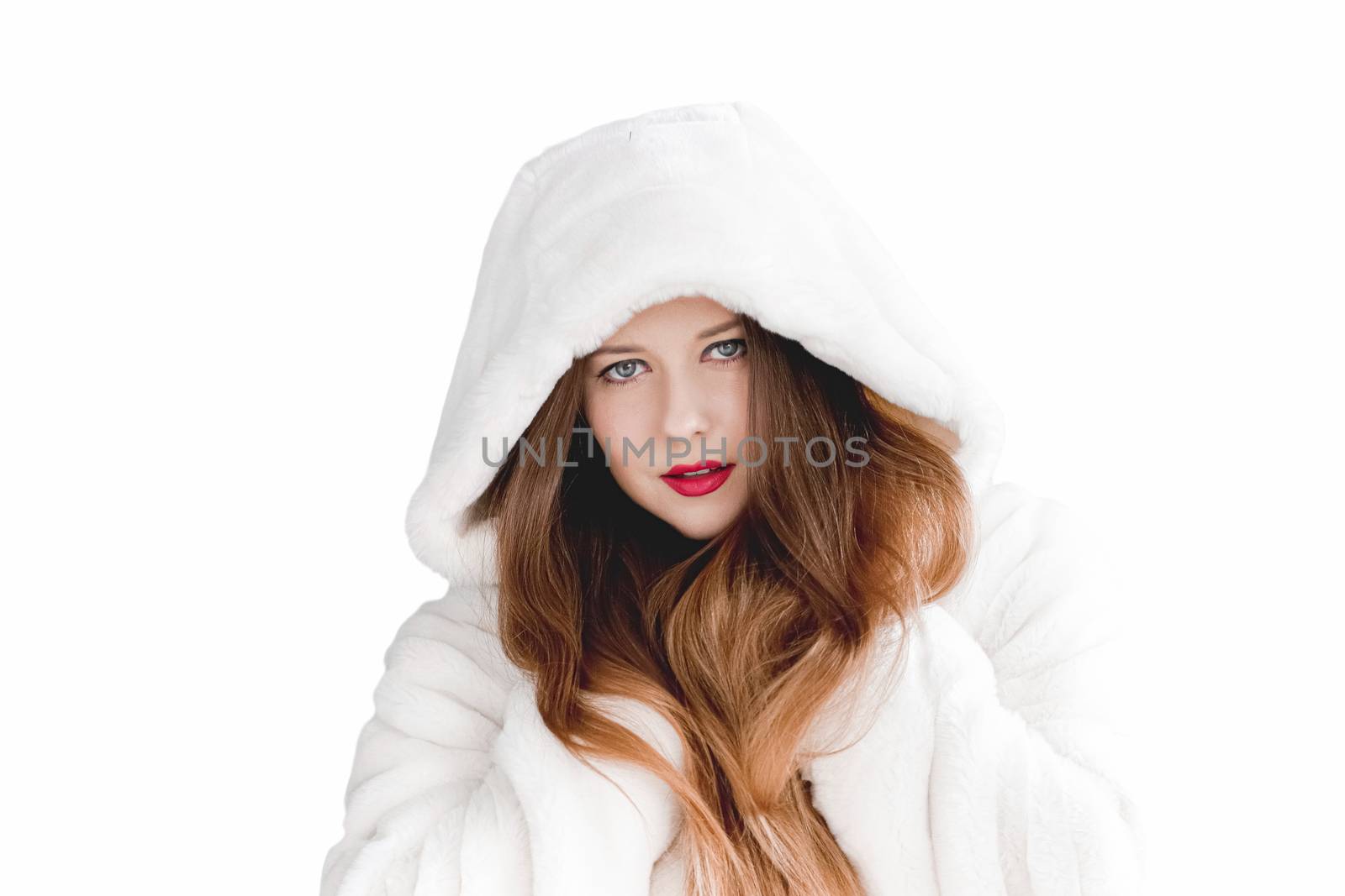 Young woman in fluffy fur coat with hood wrap, warm winter clothing for fashion and Christmas holidays design