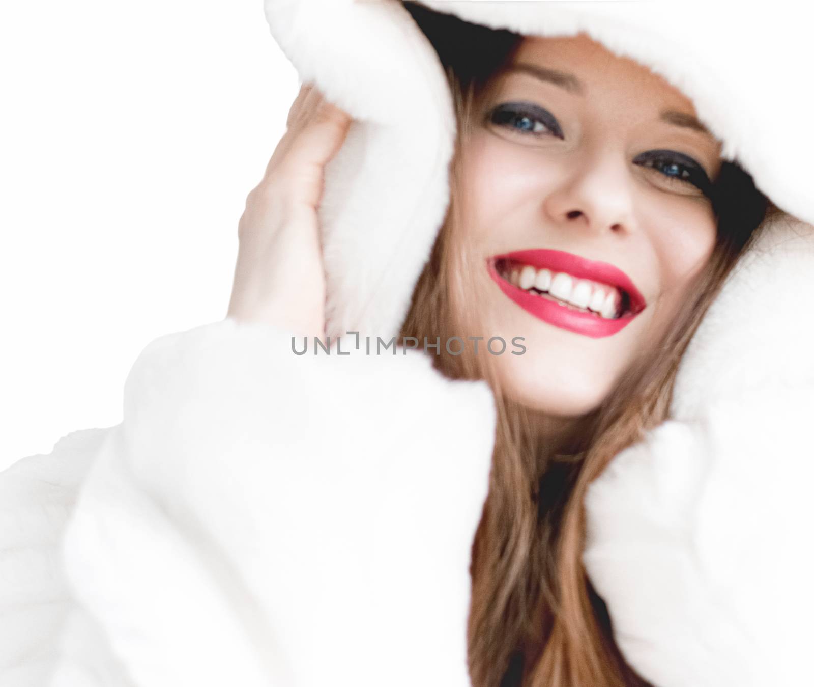 Young woman in fluffy fur coat with hood wrap, warm winter cloth by Anneleven