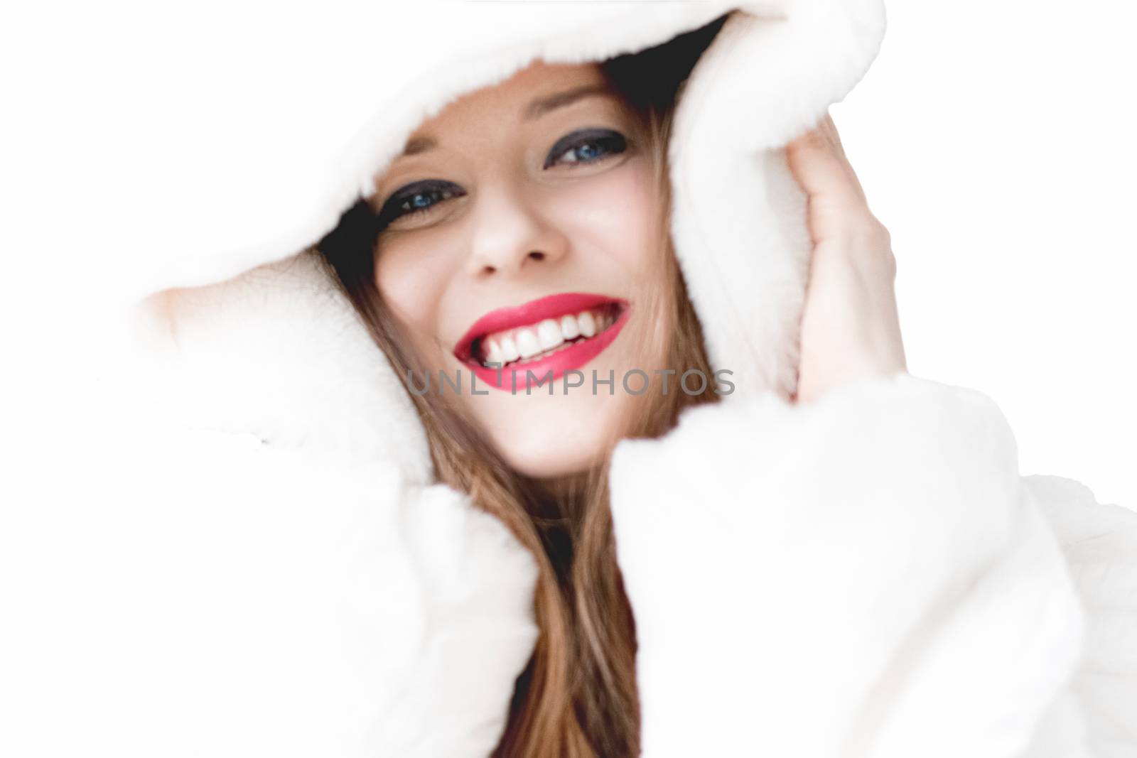 Young woman in fluffy fur coat with hood wrap, warm winter cloth by Anneleven