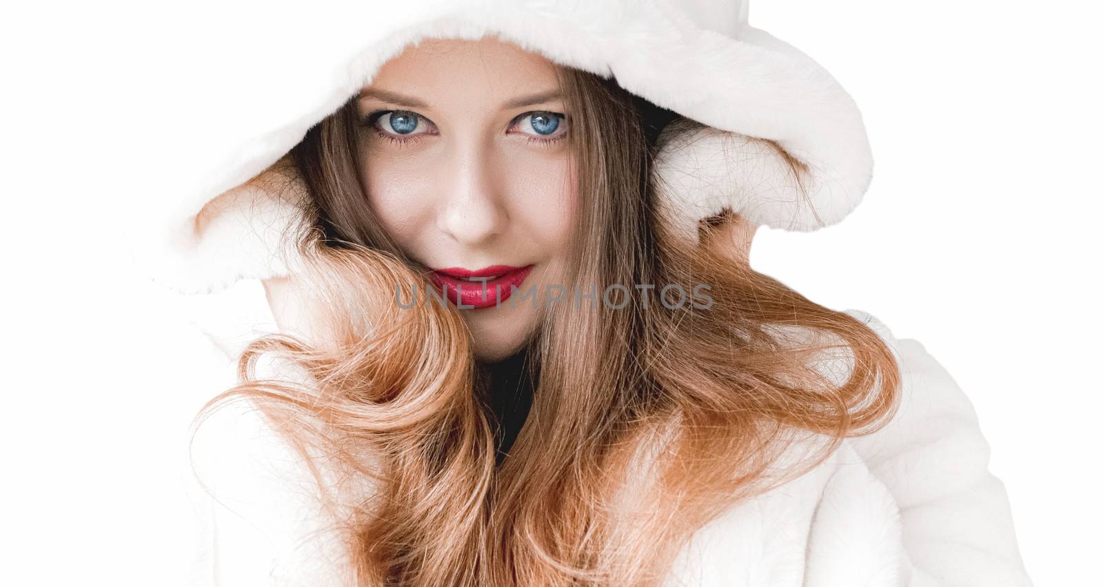 Young woman in fluffy fur coat with hood wrap, warm winter clothing for fashion and Christmas holidays design