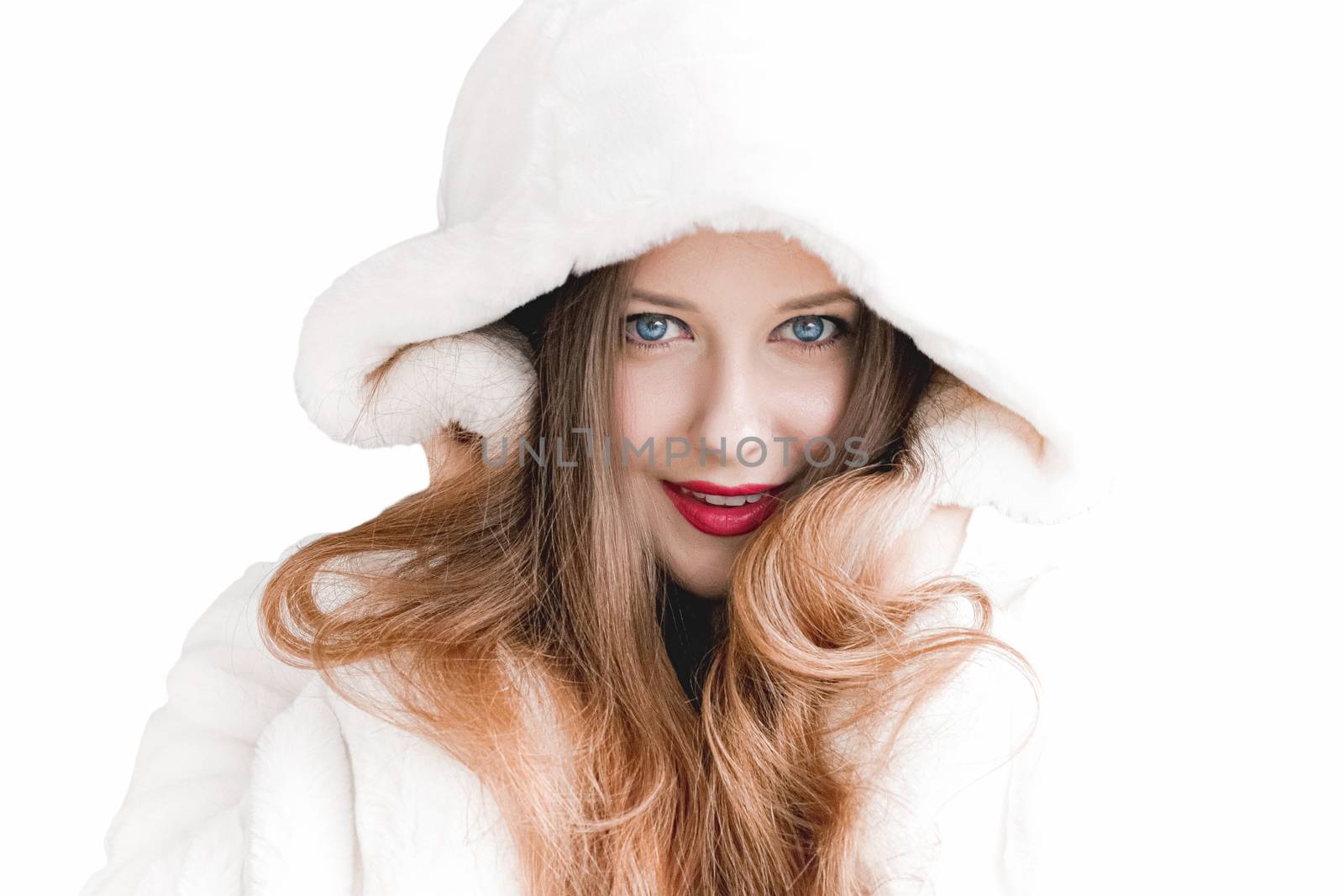 Young woman in fluffy fur coat with hood wrap, warm winter clothing for fashion and Christmas holidays design