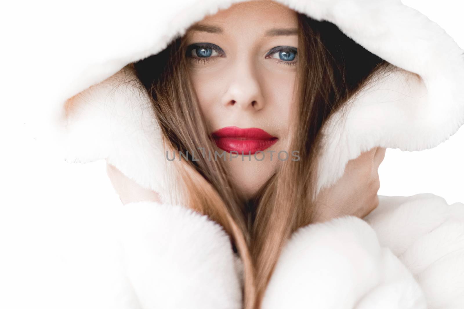 Young woman in fluffy fur coat with hood wrap, warm winter cloth by Anneleven