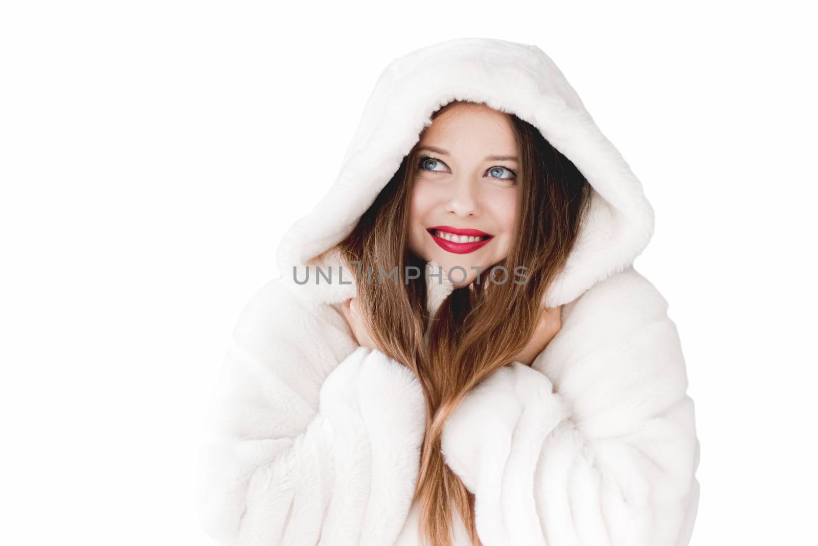 Young woman in fluffy fur coat with hood wrap, warm winter clothing for fashion and Christmas holidays design